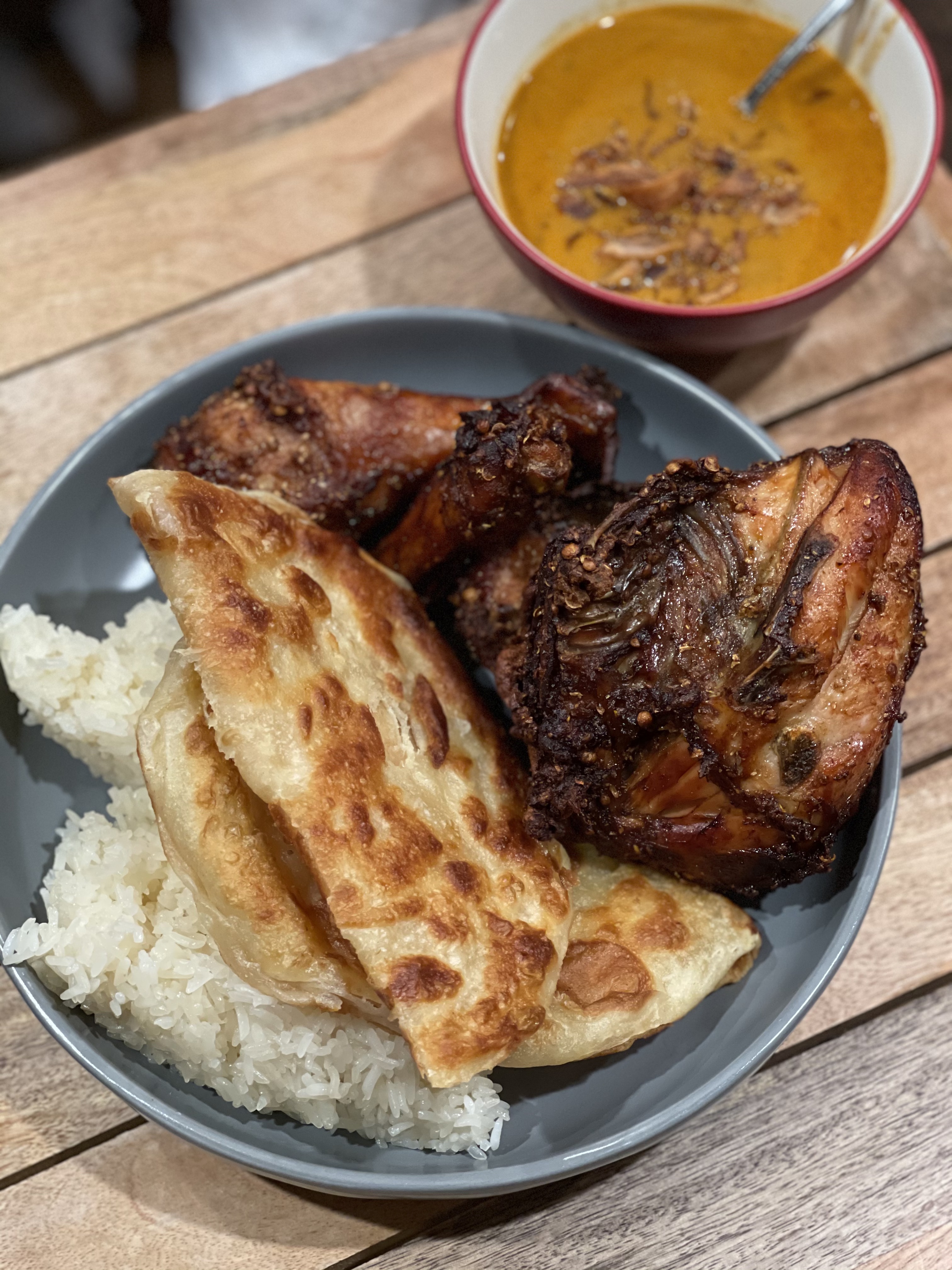 fried chicken, roti, and curry on the side