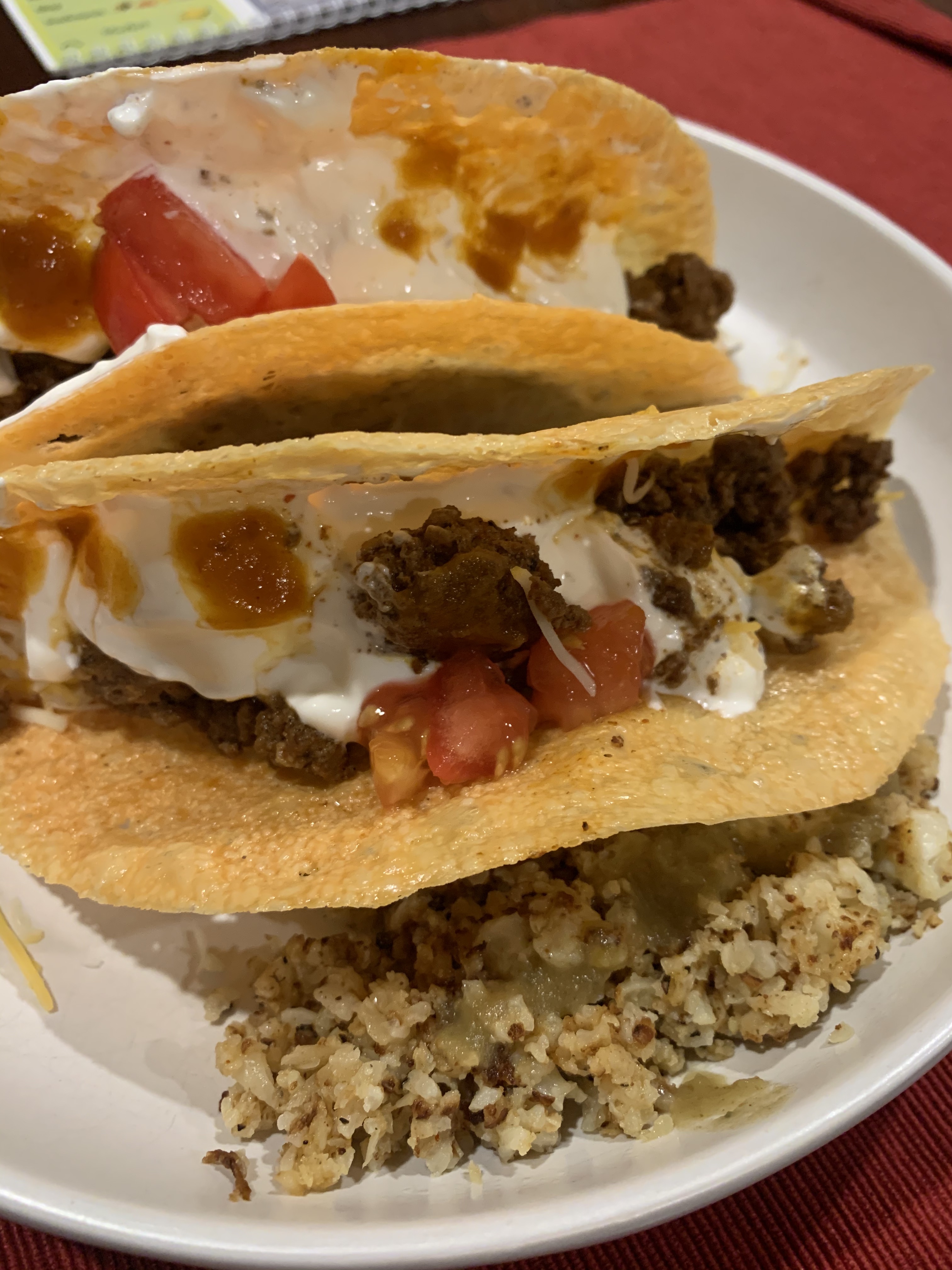 Keto tacos for dinner!  Crispy cheese shells filled with meat and fixing, side of cauliflower rice