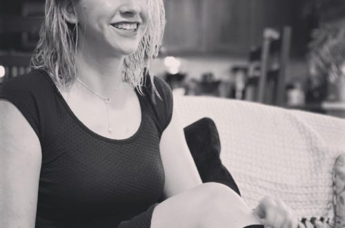 book socks, black and white picture of a girl wearing high socks sitting on a couch