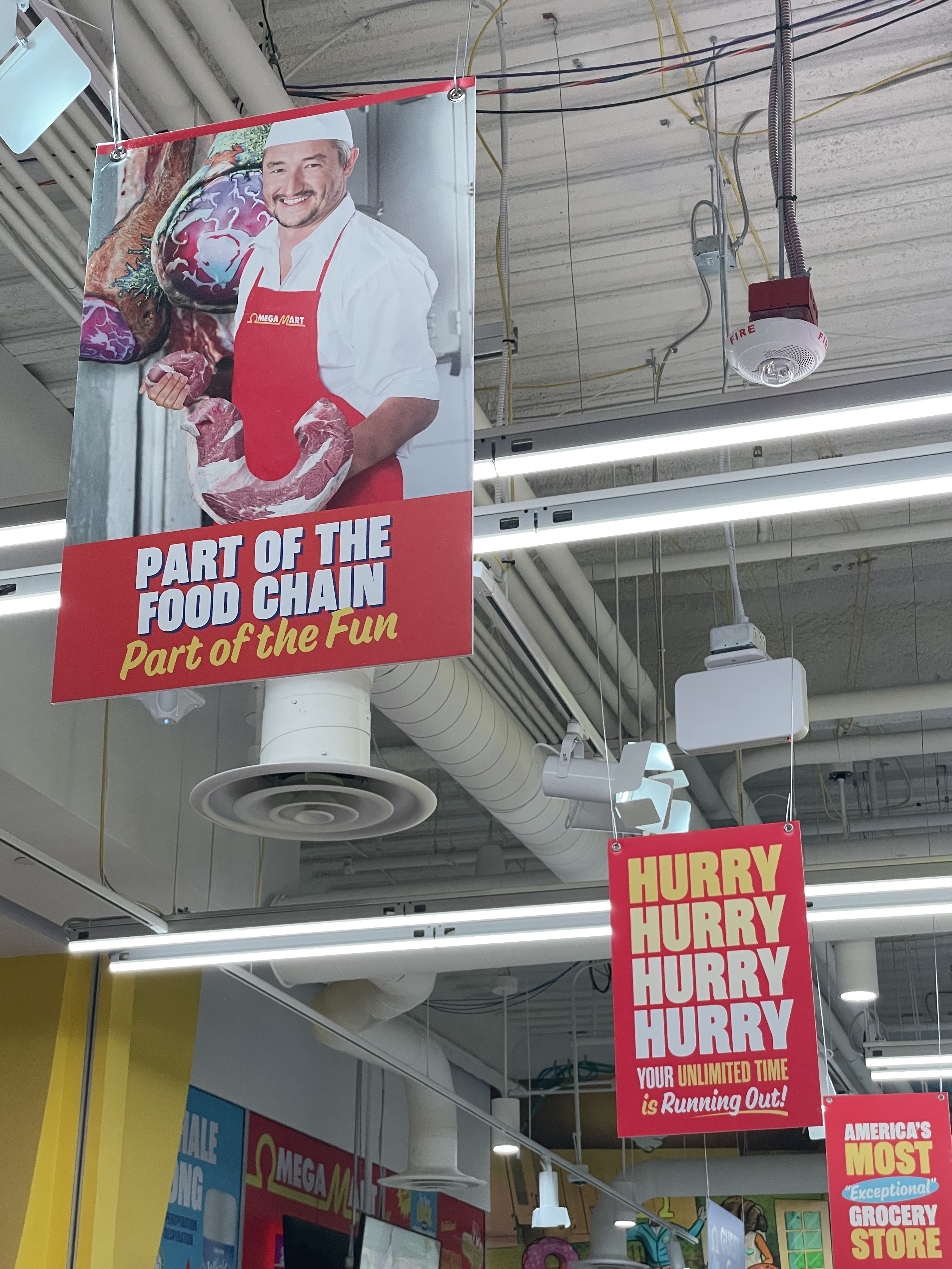 inside of Omega Mart, signs that showcase their incredible wordplay