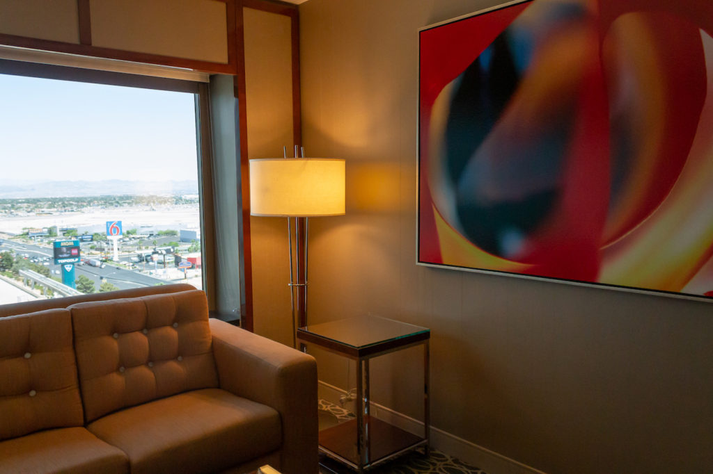 Interior suite picture from MGM Grand Las Vegas: couch, mood lamp, and wall art