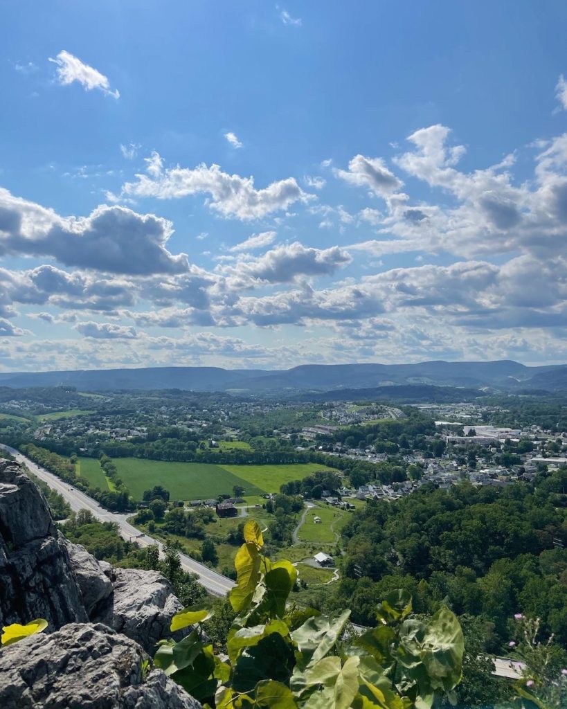 beautiful scenic overlook of Altoona, PA in the summer, bright colors of blue for the sky and green for the earth below